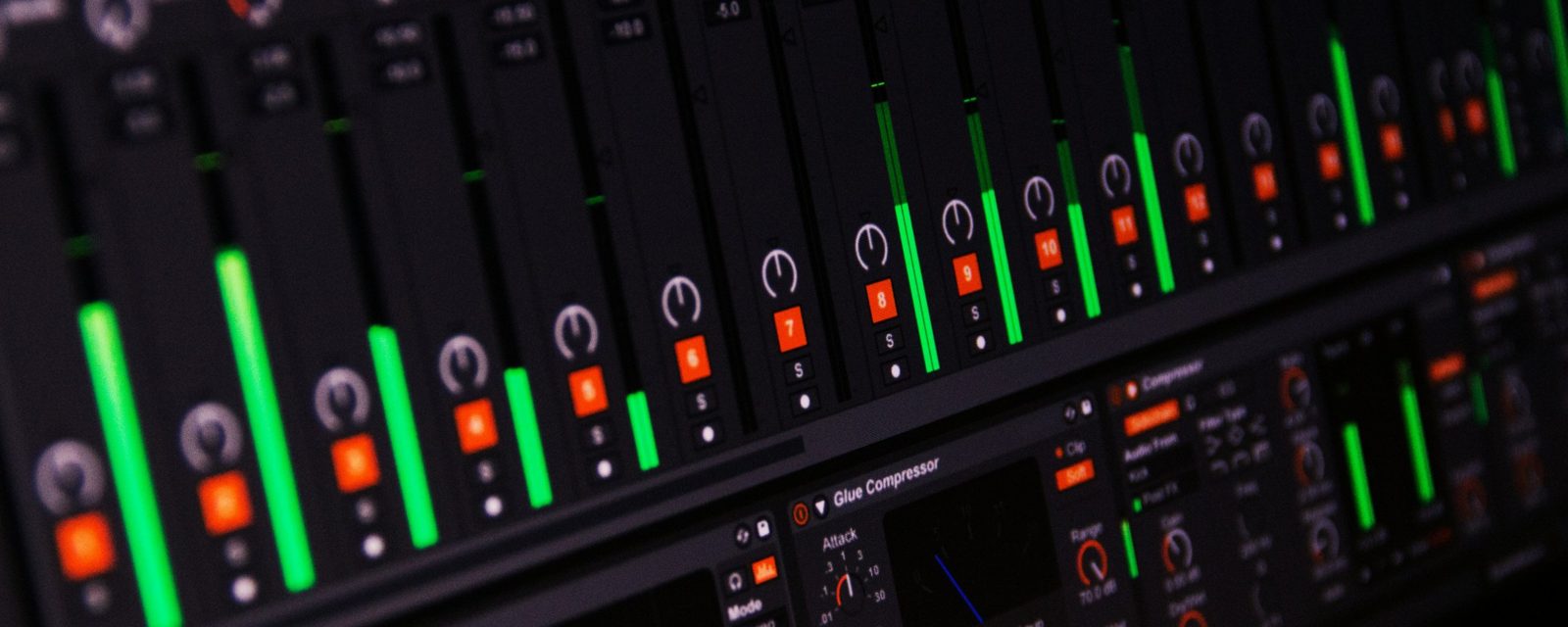 DAW mixer with channel meters and a Glue Compressor